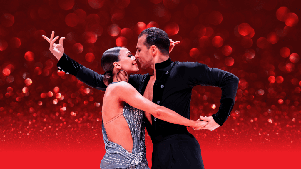 Two ballroom dancers performing against a red background.