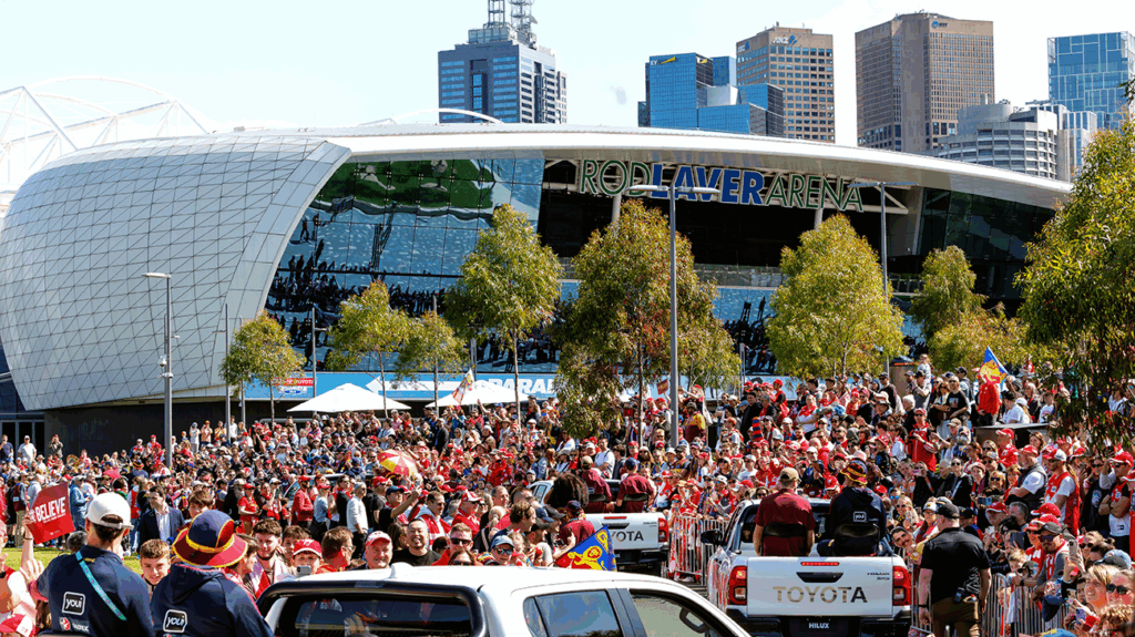 AFL football fans enjoying a parade.