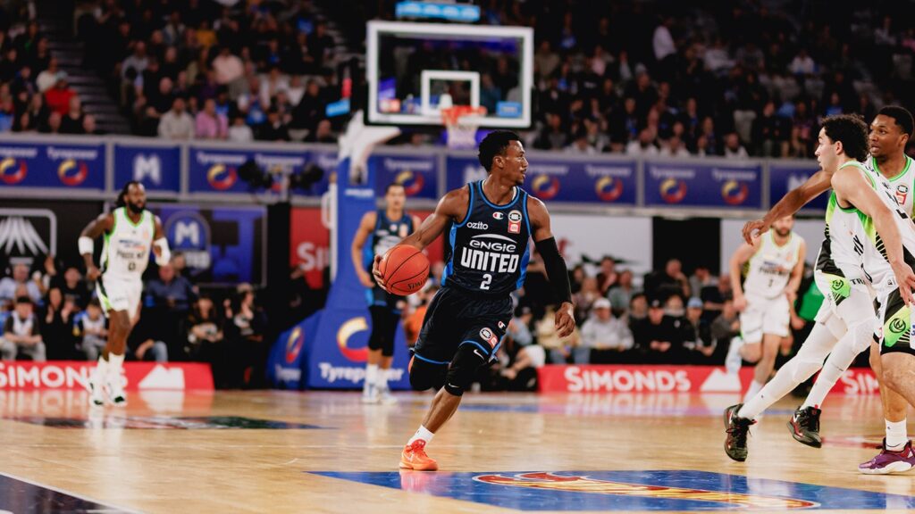 Basketball match in action at John Cain Arena.