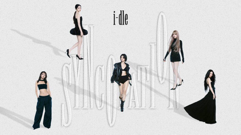 Girl group i-dle in black outfits against a white background.