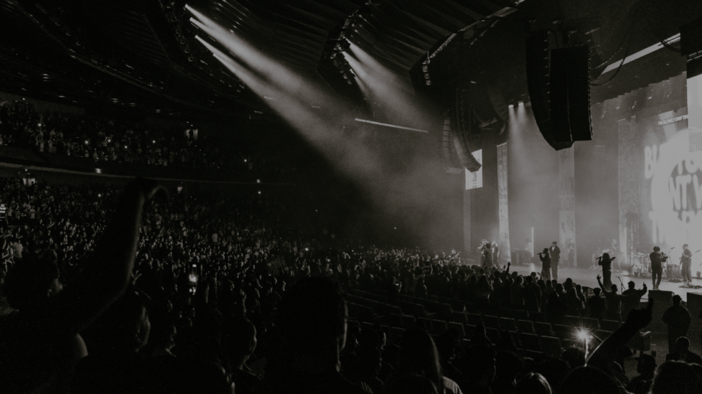 Black and white photo of a crowd enjoying a concert.