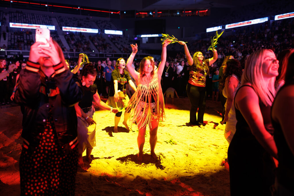 Indigenous dancers performing during a concert.