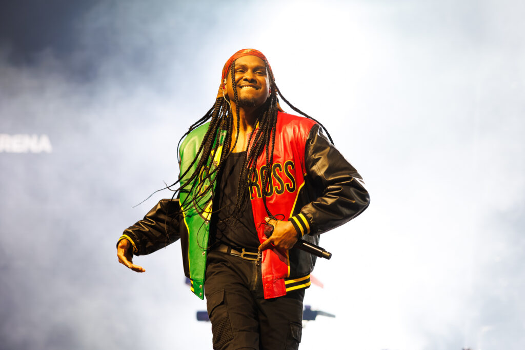 Baker Boy performing on stage during a concert.