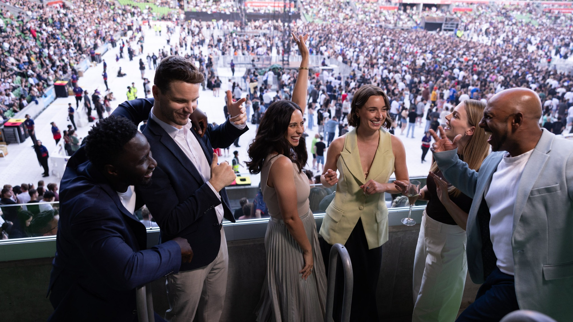 Group of people enjoying themselves at a concert.